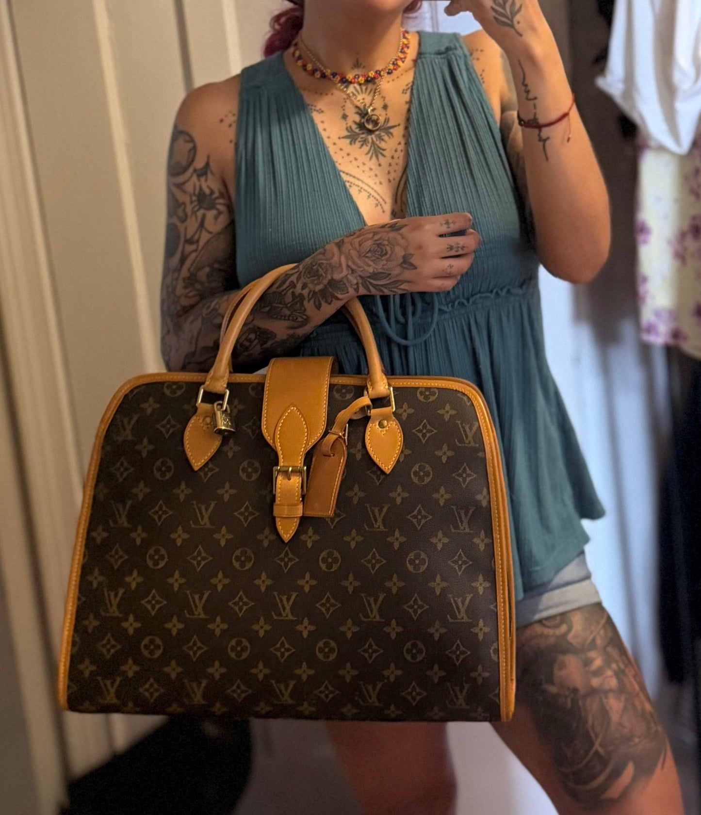 Louis Vuitton Rivoli Handbag