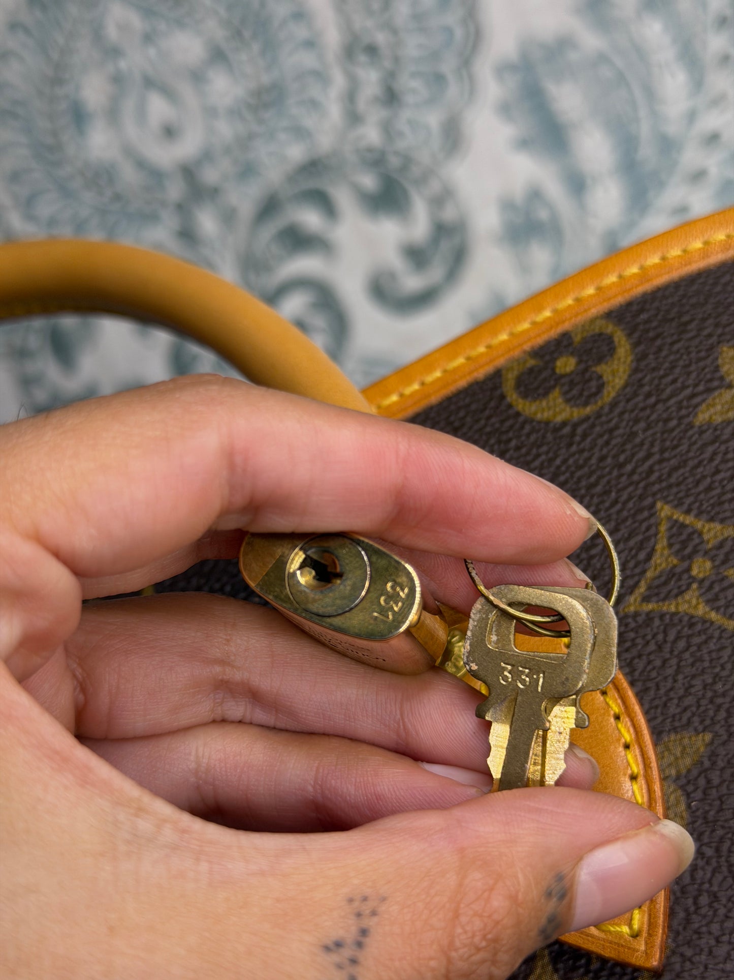 Louis Vuitton Rivoli Handbag